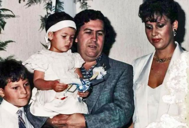 Pablo Escobar holding Manuela Escobar
