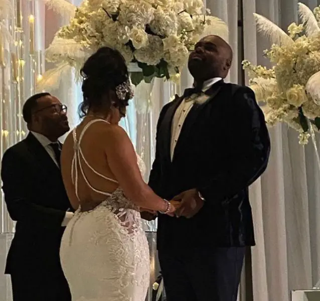 Michael Oher and his wife Tiffany Oher exchanging vows