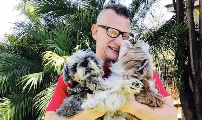 Sandy Corzine with his dogs in 2017