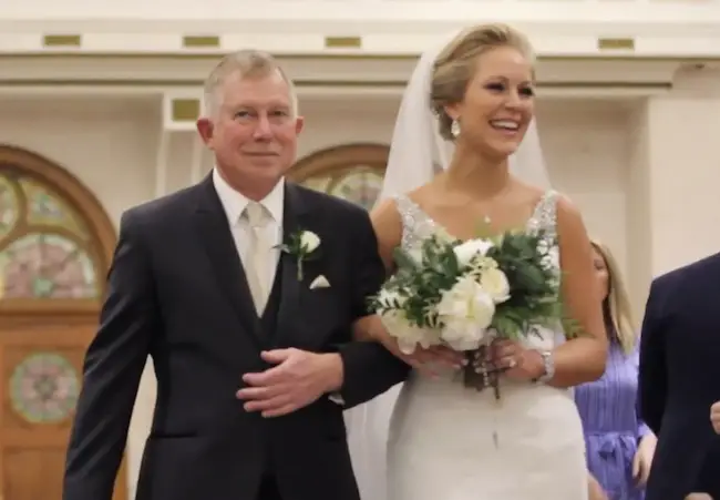 Abby Eden with her father walking down the aisle