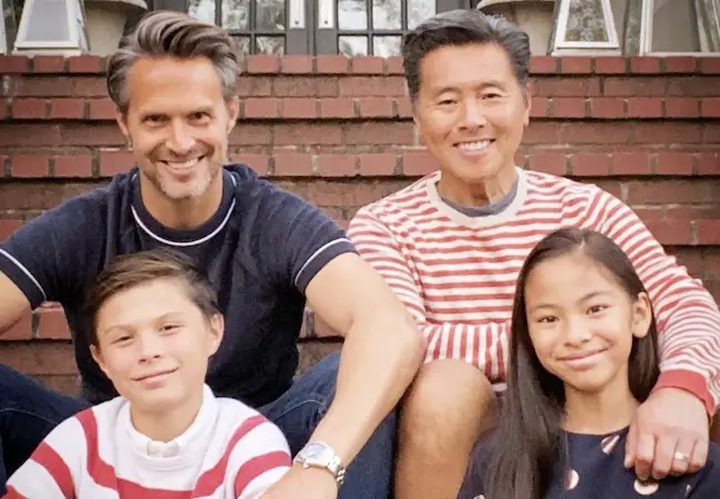 Craig Koch with his husband Vern Yip and kids.
