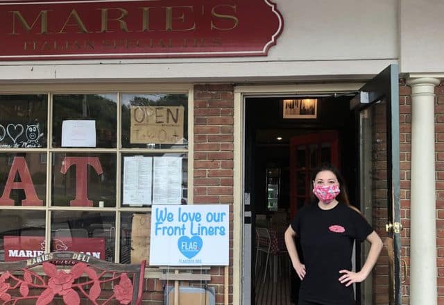 Marie Riccio in front of her restaurant