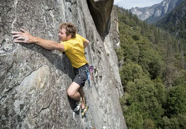 Sterling Pierce Taylor climbing a rock