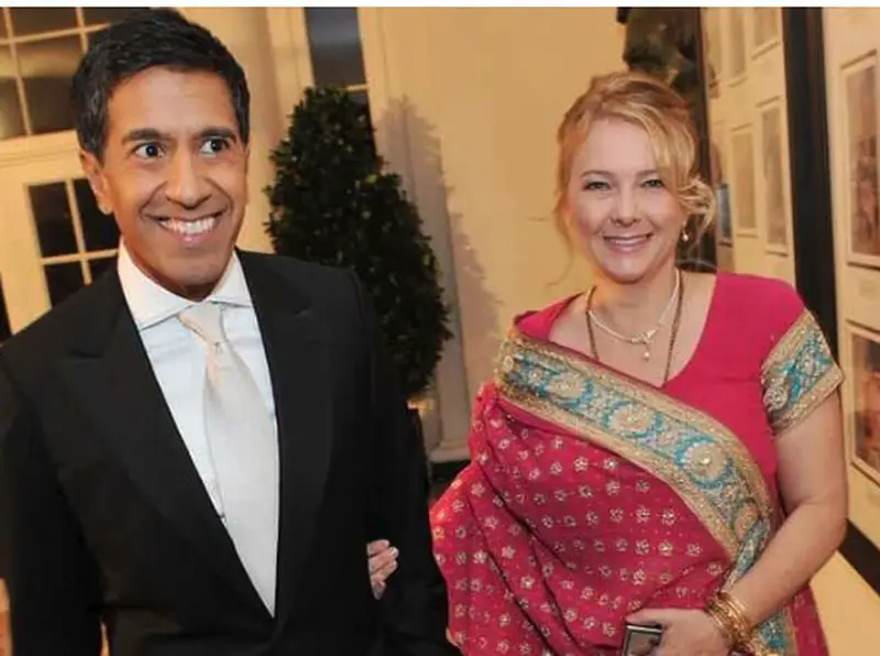 Sanjay Gupta with his wife Rebecca Olson