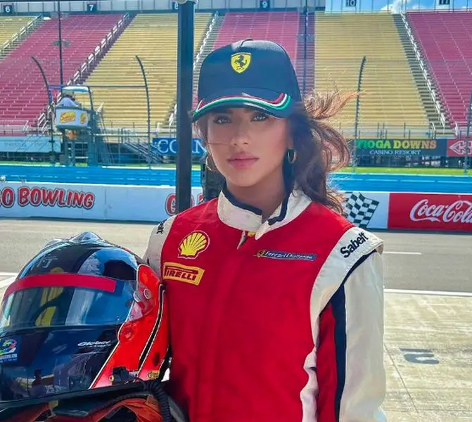 Tara Bernstein wearing a Ferrari racing suit