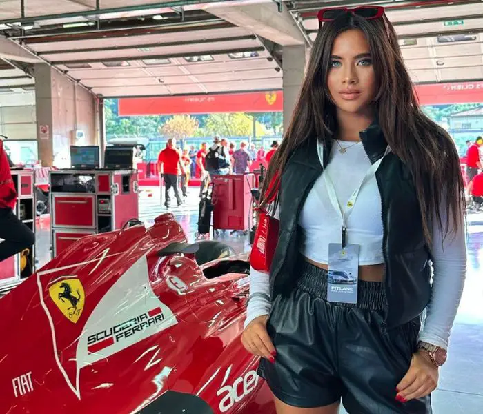 Tara Bernstein with F1 racing Ferrari