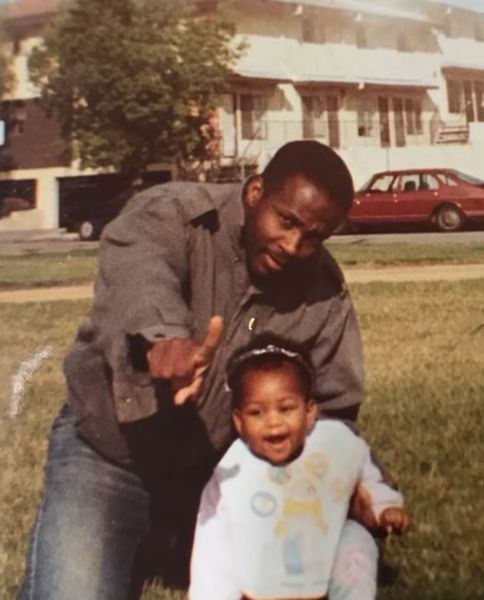 Young Somara Theodore with her father