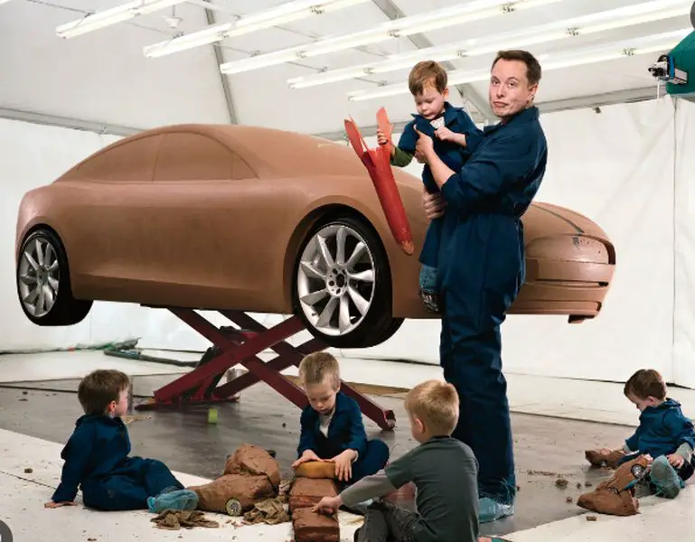 Elon Musk with his kids playing around prototype tesla