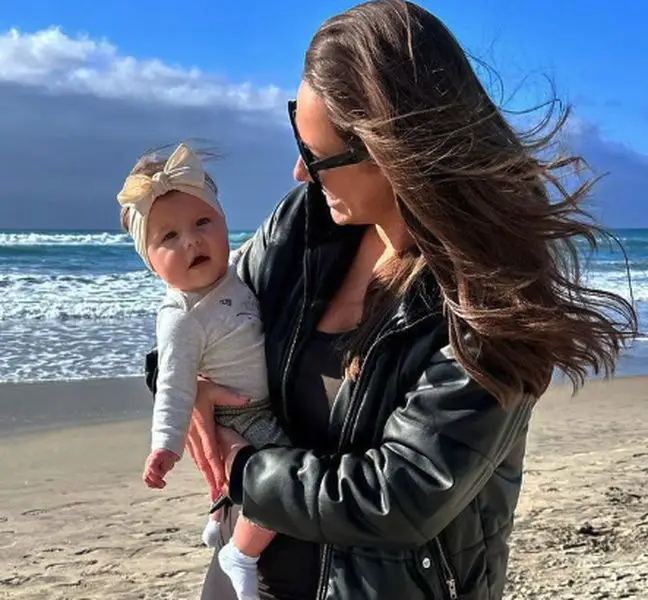 Kaitlin Sharkey with a baby