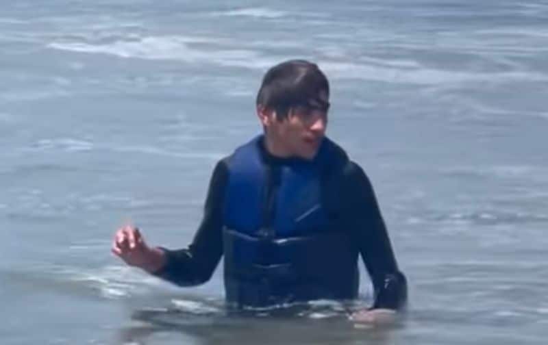 James Padraig Farrell surfing and swimming